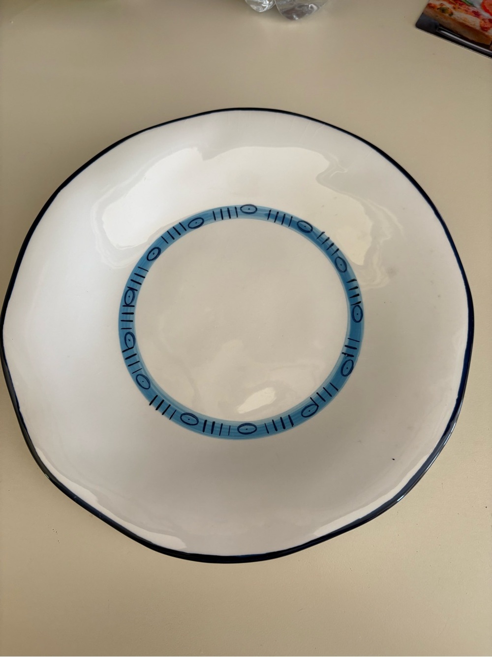 Studio D White Dinner Plate with Blue Ring Accent